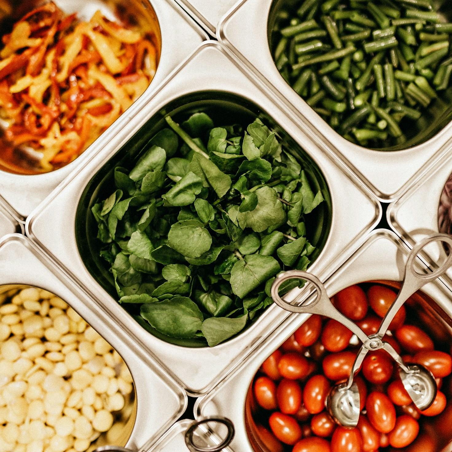 Community members collaborating in a modern kitchen space, sharing recipes and cooking techniques